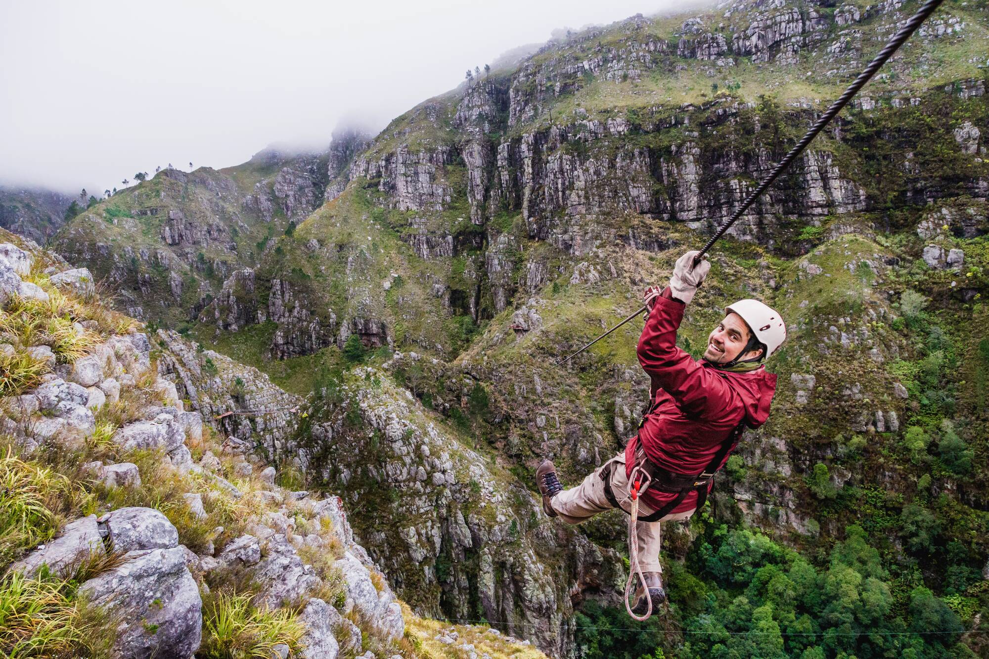 Ziplining over the valley on a day trip from Cape Town
